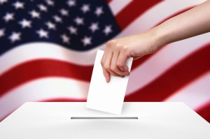 13621133 - hand with ballot and box on flag of usa